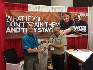 Patrick Molzahn receives the first ever Diamond credential from Scott Nelson, president of the WCA at IWF 2018.